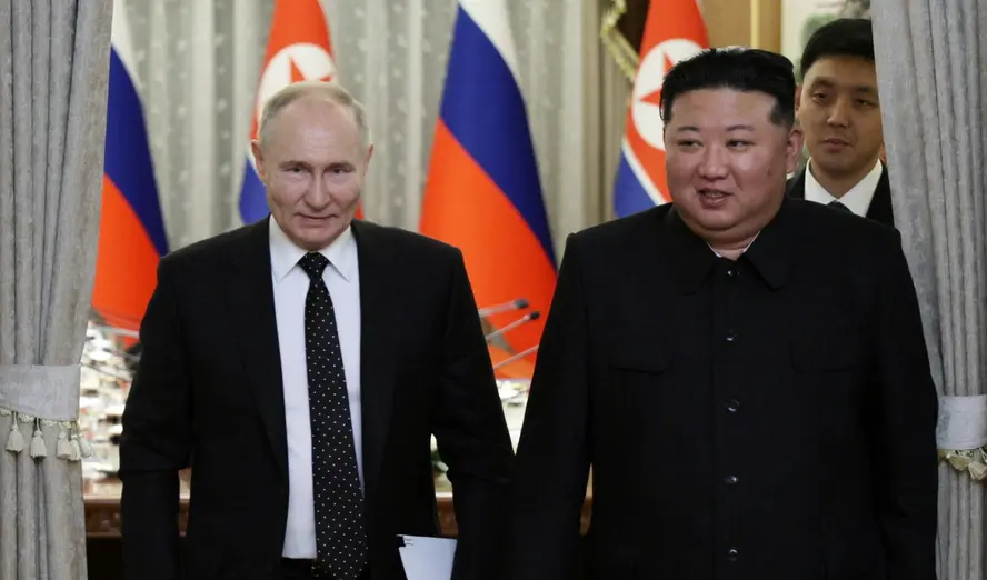 Vladimir Putin and Kim Jong-un shaking hands during the June 2024 summit