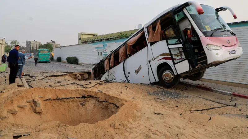 A Palestinian girl stands next to a car destroyed by debris following an Israeli airstrike on a house in Gaza, highlighting the ongoing devastation caused by the strikes in northern Gaza.
