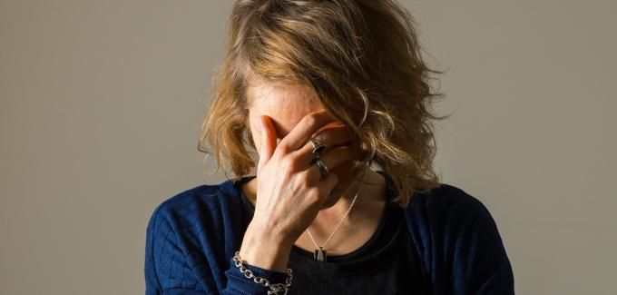 Image representing the emotional journey of a woman dealing with built-up frustration and aggression due to prolonged stress and unspoken feelings.