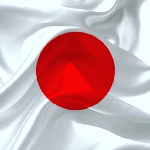 Shigeru Ishiba announcing his resignation as Prime Minister of Japan in front of a Japanese flag and microphones at a podium.