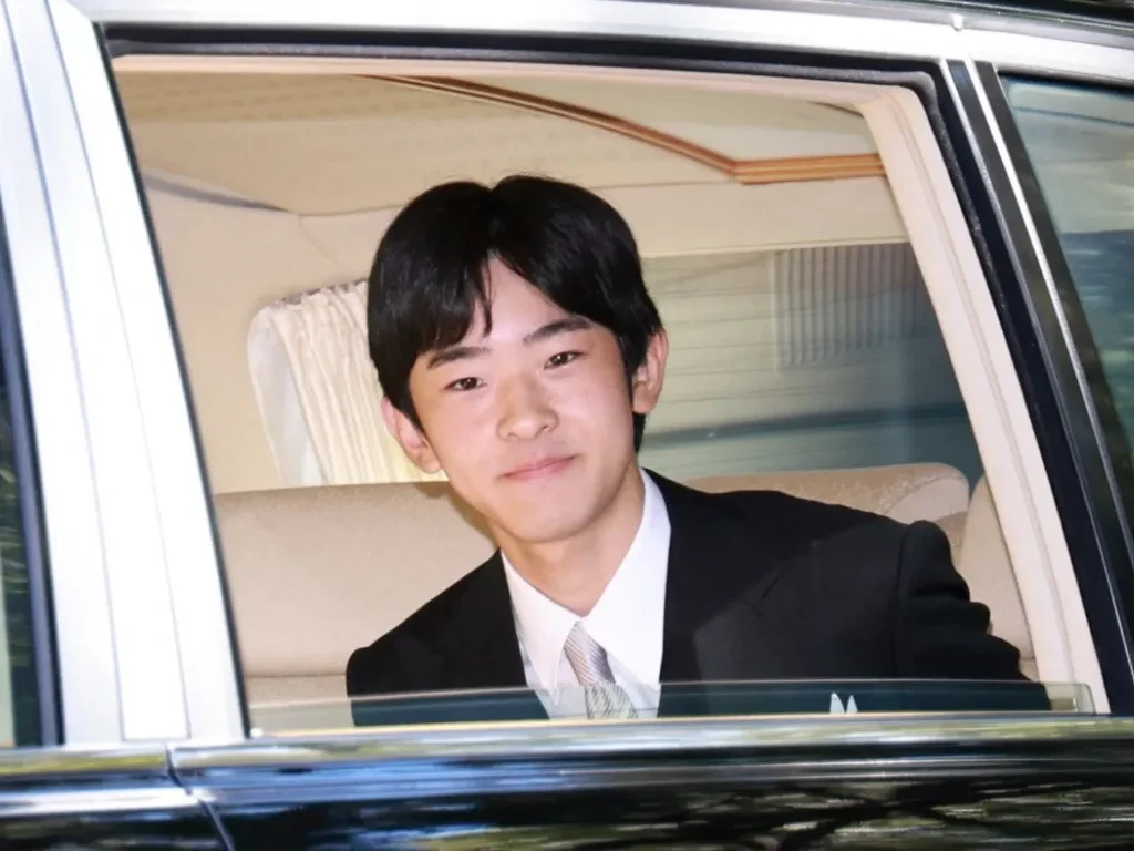 "Prince Hisahito of Japan wearing a traditional yellow robe during his coming-of-age ceremony at the Imperial Palace in Tokyo."