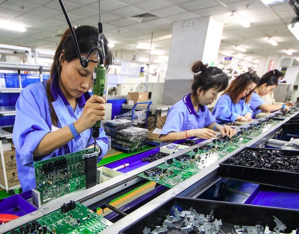 Worker producing EV battery parts at a workshop in Huzhou, Zhejiang province, China, February 2025
