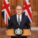 UK Prime Minister Keir Starmer delivering a statement on Middle East defensive operations from a podium